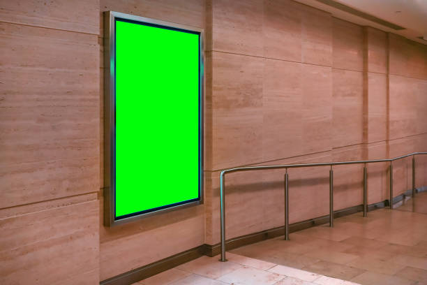 istock Wall with light display ad board - green color advertisement mock up 1312784210