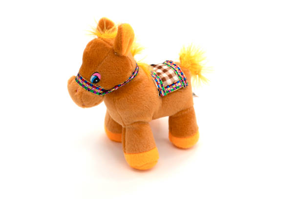 istock Brown stuffed horse toy isolated on white 1312785138