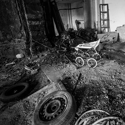 Old pram in abandoned orphanage, monochrome