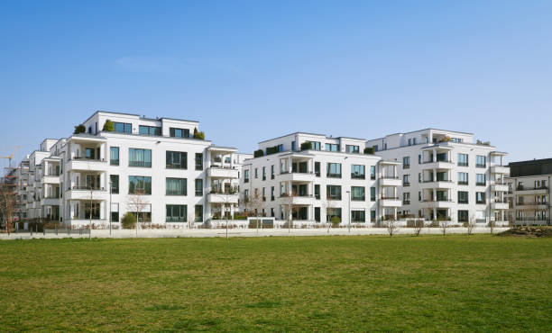 istock Modern white apartment houses and blue sky 1312786452