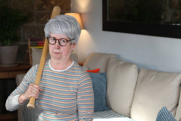 istock Angry senior woman at home 1312787704
