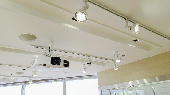 Video projector on ceiling, Business conference interior or lecture in office