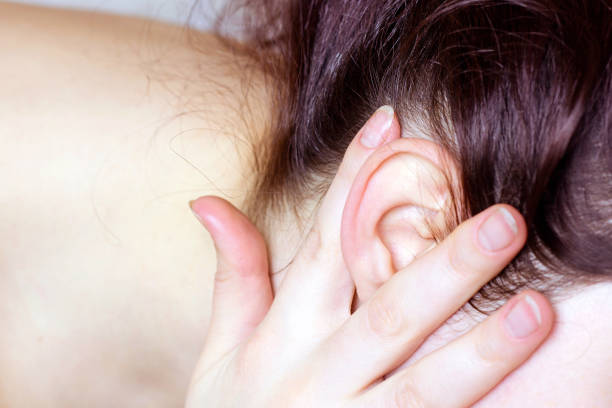 Detail of the head with the hair and ear at doctor's exam close up Detail of the head with the hair and ear at doctor's exam close up. Earlobe stock pictures, royalty-free photos & images