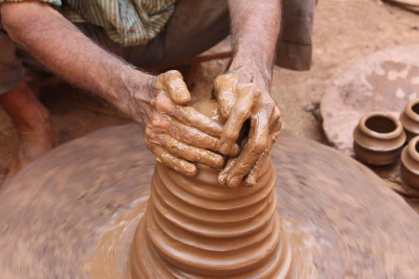 istock Artisans hand while making pottery, Kumbharwada, Mumbai, India 1312792601