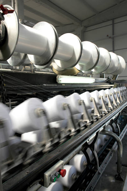 istock Spinning machine in textile factory 1312793427