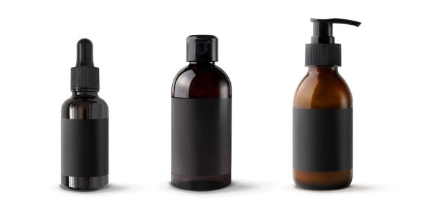 istock Set brown bottles for cosmetic products 3d realistic vector illustration, isolated. Plastic and glass mockup containers with black empty label sticker 1312793776