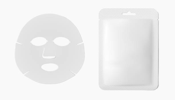 istock Facial beauty sheet mask and white plastic packaging sachet isolated on white background. Skincare product mockup 3d realistic vector illustration 1312793823