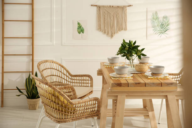 istock Stylish wooden dining table and chairs in room. Interior design 1312795350