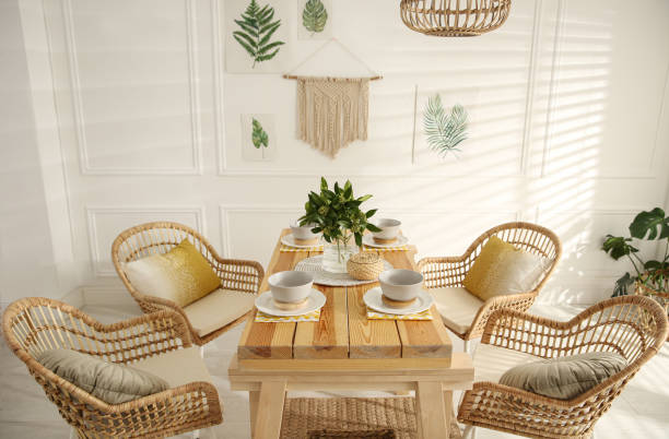 istock Stylish wooden dining table and chairs in room. Interior design 1312795653