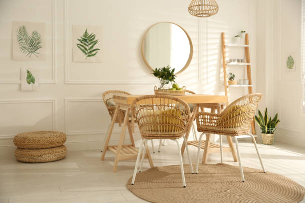 istock Stylish wooden dining table and chairs in room. Interior design 1312795791