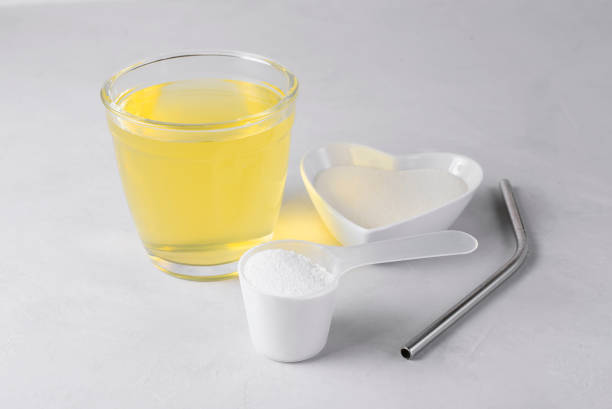 istock Collagen protein powder drink hydrolyzed supplement on light background. Concept of saving natural beauty and health, skin elasticity, firmness. Healthy lifestyle. Retard aging 1312796761