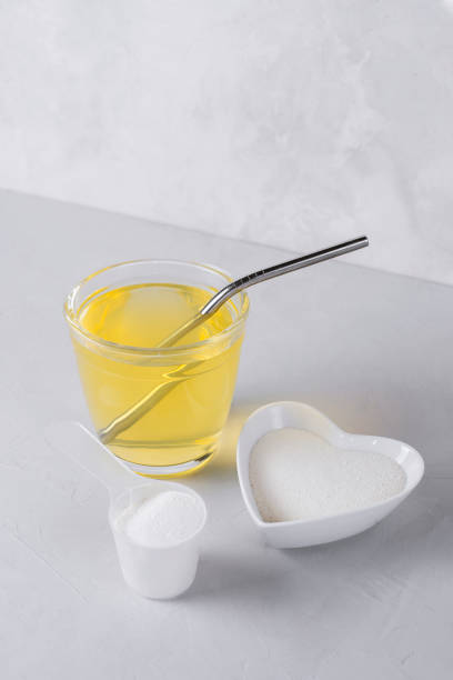 istock Collagen protein powder drink hydrolyzed supplement on light background. Concept of saving natural beauty and health, skin elasticity, firmness. Healthy lifestyle. Retard aging 1312796834