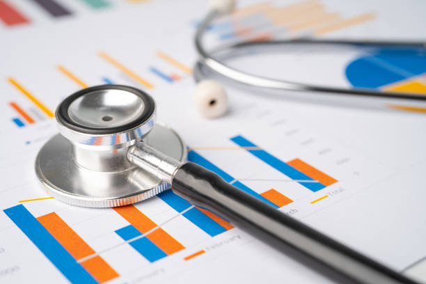 istock Stethoscope on chart graph paper, finance, account, statistic, analytic economy Business concept. 1312798701