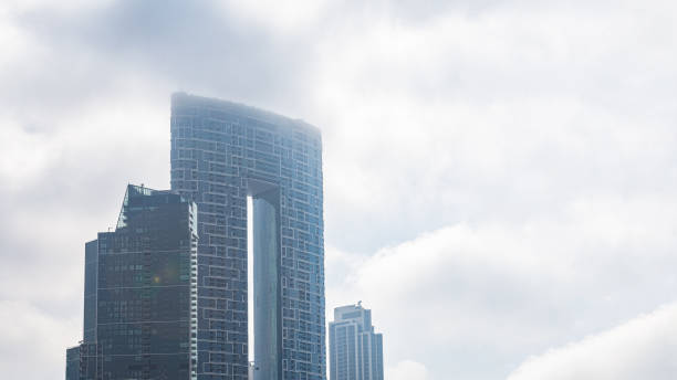 istock Modern architecture sky scrapers on a foggy day 1312798846