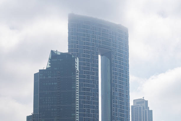 istock Modern architecture sky scrapers on a foggy day 1312798847