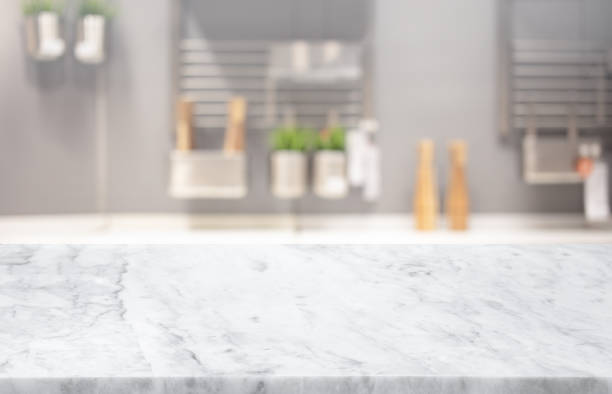istock Selective focus,Marble table top on blur white kitchen room background.F 1312800174