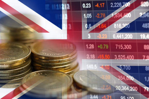 Stock market investment trading financial, coin and United Kingdom England flag or Forex for analyze profit finance business trend data background. stock photo