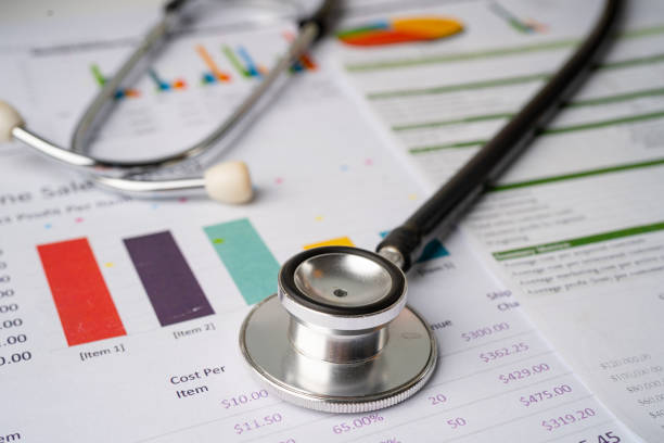 istock Stethoscope on charts and graphs paper, Finance, Account, Statistics, Investment, Analytic research data economy and Business company concept. 1312800499