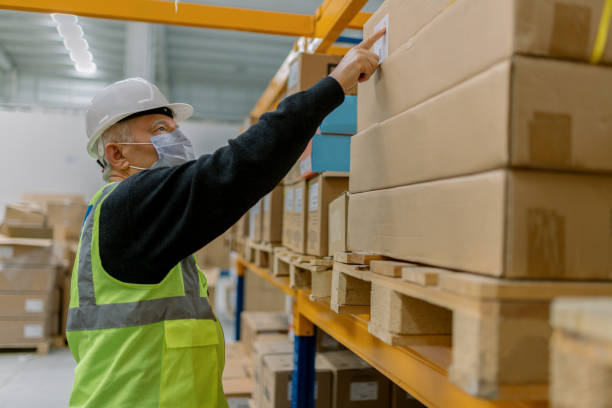 istock Factory worker  working in a factory 1312801399