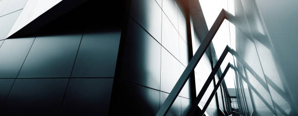 istock commercial building skyscraper made of glass. Website header or banner 1312804979