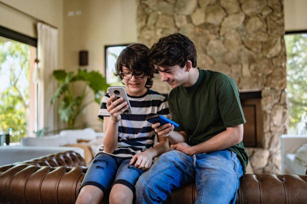 istock Teenagers playing on a smart phone 1312805847