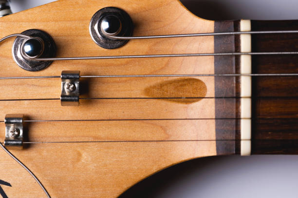 istock Close-up elements of electric guitar on gray background 1312805953