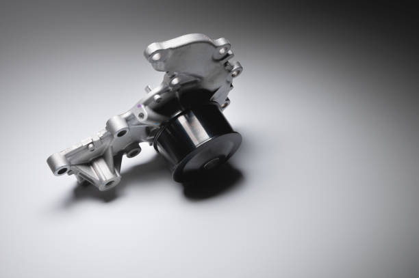 istock Water pump of the internal combustion engine cooling system. Contrasting on a gray gradient 1312806404