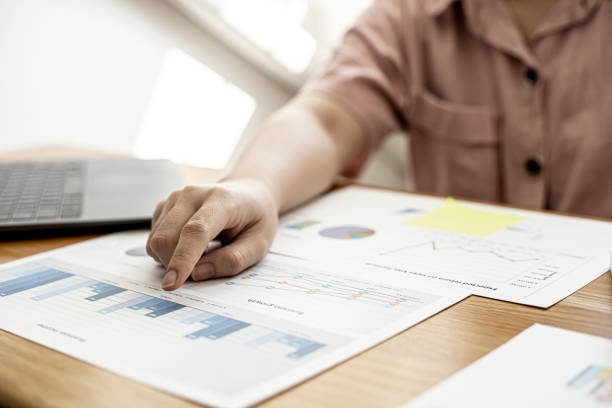 istock Finance employees are reviewing the financial information on documents that were prepared before sending them to management for a meeting with shareholders. Financial concept. 1312809733