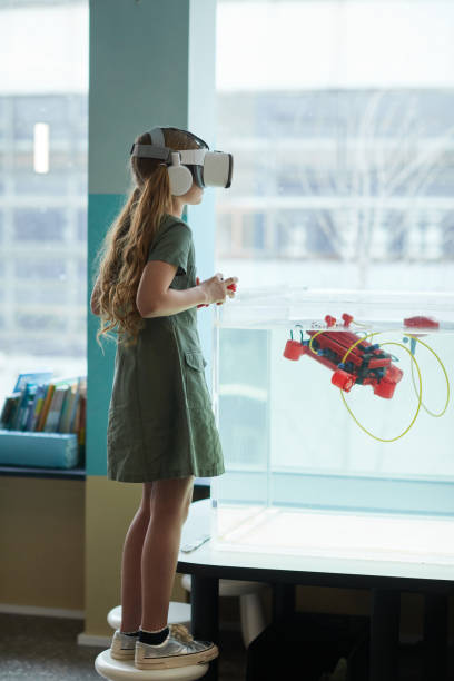 istock Girl Operating Water Robot 1312810157