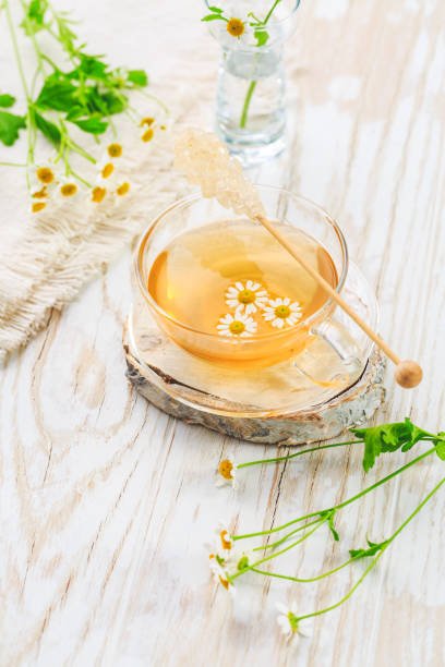 istock Cup of Chamomile tea on wooden kitchen table 1312811985