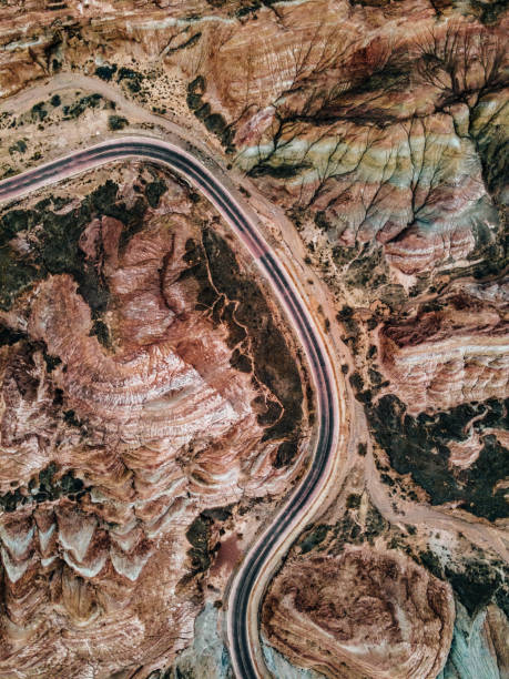 Aerial View of Rural Road through through Danxia Landform Aerial View of Rural Road through through Danxia Landform canyon road stock pictures, royalty-free photos & images