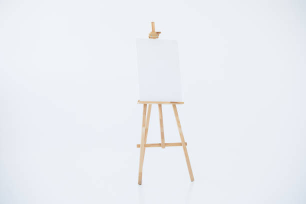 istock advertising stand or flip chart or blank artist easel isolated on white. 1312813439