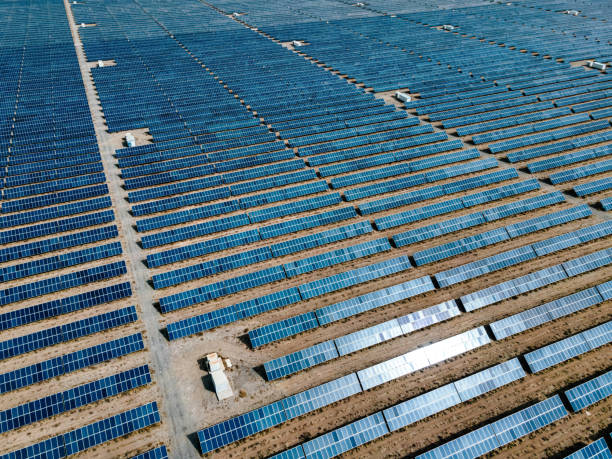istock Drone Point View of Solar Panels in Desert 1312814027