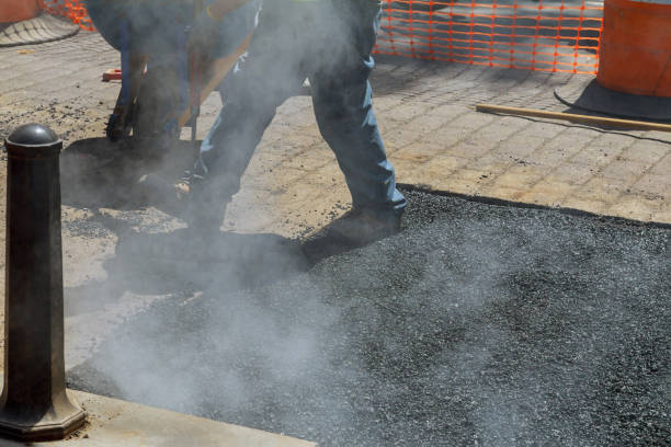 istock New road construction a repair asphalt covering while laying asphalt 1312815250