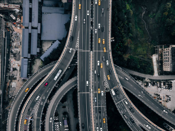 istock Aerial View of Complex Overpass and Busy Traffic 1312815871