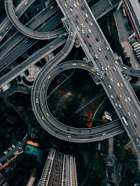 istock Aerial View of Complex Overpass and Busy Traffic 1312816495