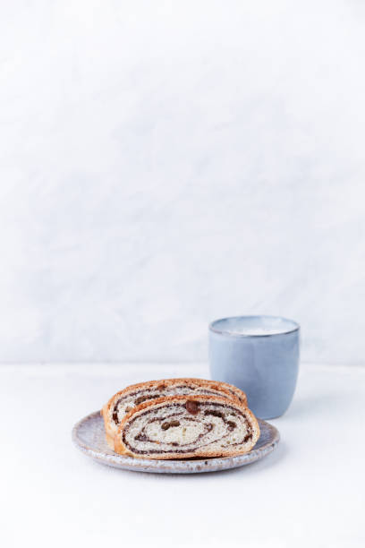 istock Sweet bun and Cappuccino on bright wooden background. Copy space. 1312819627