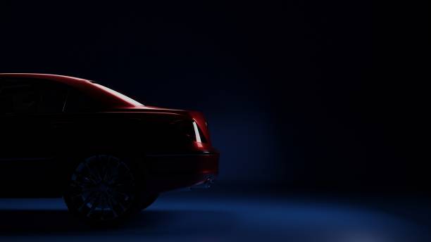 istock red car on the side in the dark on a blue background 1312819636