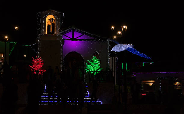 istock Catholic church at night with Christmas lights 1312820880