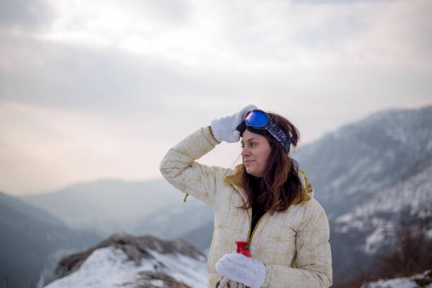 istock Young woman enjoying winter in mountains 1312820938