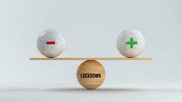 istock spheres forming a scale with message LOCKDOWN and PLUS and MINUS symbol  - 3d illustration 1312822082