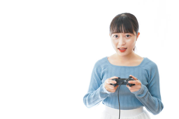 istock Young woman playing video game 1312822530