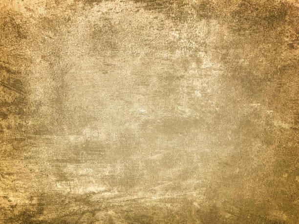 istock Texture decorative light beige plaster imitating old peeling wall with dark vignette. Obsolete golden stone background 1312823271