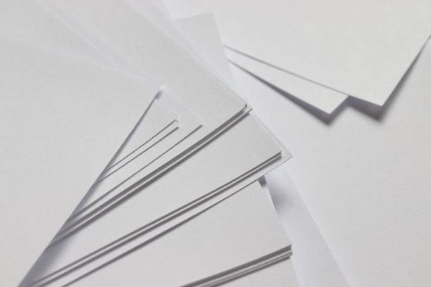 istock pile of white paper ,white texture background 1312823413