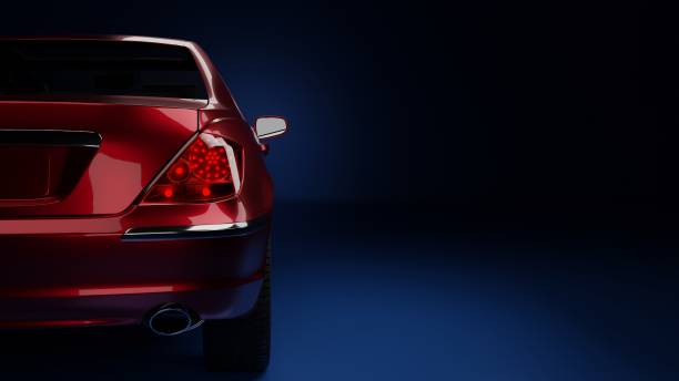 istock red car on the side in the dark on a blue background 1312827105