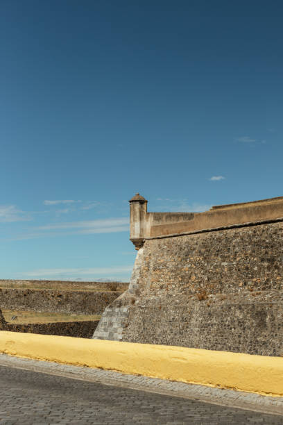 istock Road By Wall Against Blue Sky 1312828057