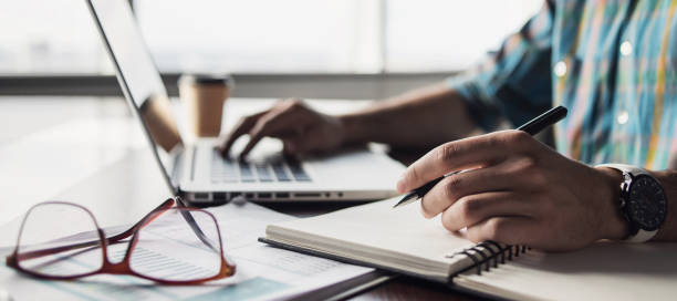 istock Businessman or journalist working at office 1312831656