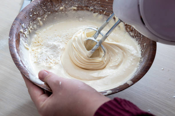 istock Mixing the dough in a bowl with a mixer. Selective focus. 1312832322
