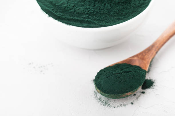 istock spirulina powder in a cup and spoon 1312833678