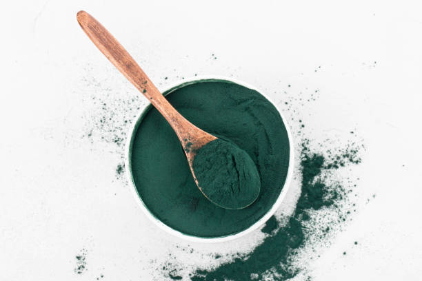 istock spirulina powder in a cup and spoon 1312833680
